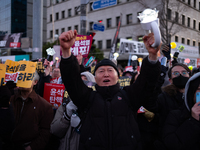 Citizens cheer after the impeachment of President Yoon Suk-yeol is passed in Seoul, South Korea, on December 14, 2024. Approximately 2 milli...