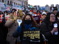 Citizens cheer after the impeachment of President Yoon Suk-yeol is passed in Seoul, South Korea, on December 14, 2024. Approximately 2 milli...