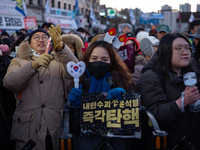 Citizens cheer after the impeachment of President Yoon Suk-yeol is passed in Seoul, South Korea, on December 14, 2024. Approximately 2 milli...