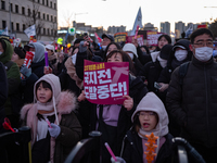 Citizens cheer after the impeachment of President Yoon Suk-yeol is passed in Seoul, South Korea, on December 14, 2024. Approximately 2 milli...