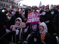 Citizens cheer after the impeachment of President Yoon Suk-yeol is passed in Seoul, South Korea, on December 14, 2024. Approximately 2 milli...