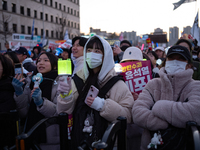 Citizens cheer after the impeachment of President Yoon Suk-yeol is passed in Seoul, South Korea, on December 14, 2024. Approximately 2 milli...