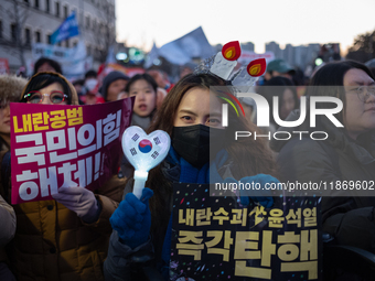 Citizens cheer after the impeachment of President Yoon Suk-yeol is passed in Seoul, South Korea, on December 14, 2024. Approximately 2 milli...