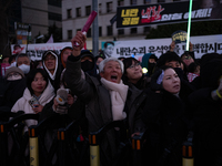 Citizens cheer after the impeachment of President Yoon Suk-yeol is passed in Seoul, South Korea, on December 14, 2024. Approximately 2 milli...