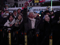 Citizens cheer after the impeachment of President Yoon Suk-yeol is passed in Seoul, South Korea, on December 14, 2024. Approximately 2 milli...