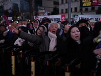 Citizens cheer after the impeachment of President Yoon Suk-yeol is passed in Seoul, South Korea, on December 14, 2024. Approximately 2 milli...