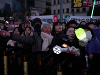 Citizens cheer after the impeachment of President Yoon Suk-yeol is passed in Seoul, South Korea, on December 14, 2024. Approximately 2 milli...