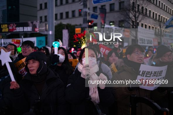 Citizens cheer after the impeachment of President Yoon Suk-yeol is passed in Seoul, South Korea, on December 14, 2024. Approximately 2 milli...