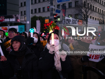 Citizens cheer after the impeachment of President Yoon Suk-yeol is passed in Seoul, South Korea, on December 14, 2024. Approximately 2 milli...