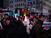 Citizens cheer after the impeachment of President Yoon Suk-yeol is passed in Seoul, South Korea, on December 14, 2024. Approximately 2 milli...