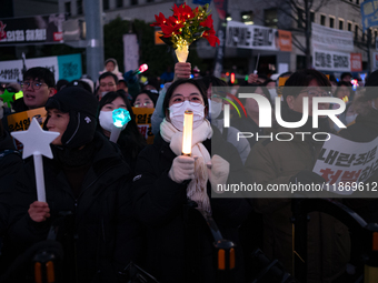 Citizens cheer after the impeachment of President Yoon Suk-yeol is passed in Seoul, South Korea, on December 14, 2024. Approximately 2 milli...