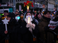 Citizens cheer after the impeachment of President Yoon Suk-yeol is passed in Seoul, South Korea, on December 14, 2024. Approximately 2 milli...