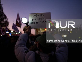 Citizens cheer after the impeachment of President Yoon Suk-yeol is passed in Seoul, South Korea, on December 14, 2024. Approximately 2 milli...