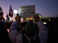 Citizens cheer after the impeachment of President Yoon Suk-yeol is passed in Seoul, South Korea, on December 14, 2024. Approximately 2 milli...