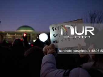 Citizens cheer after the impeachment of President Yoon Suk-yeol is passed in Seoul, South Korea, on December 14, 2024. Approximately 2 milli...