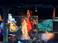 A shopkeeper prepares food for breakfast in a roadside shop in Kolkata, India, on December 15, 2024. (