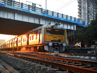 People travel on a Suburban Railway in Kolkata, India, on December 15, 2024. (