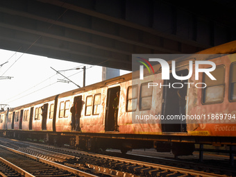 People travel on a Suburban Railway in Kolkata, India, on December 15, 2024. (