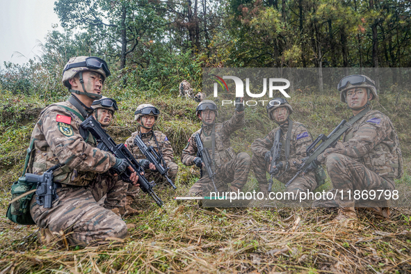 Armed police conduct an anti-terrorism drill in Guiyang, Guizhou province, China, on December 6, 2024. 