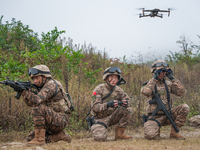 Armed police officers conduct an anti-terrorism drill using drones in Guiyang, Guizhou province, China, on December 6, 2024. (