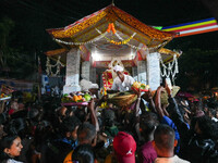 People attend a procession before the start of the Adams Peak (Sri Pada) season in Ratnapura, Sri Lanka, on December 13, 2024. The site is k...