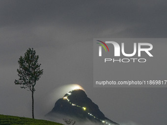 Lights illuminate the Adams Peak (Sri Pada) mountain during the season in Maskeliya, Sri Lanka, on December 14, 2024. It is well known for t...