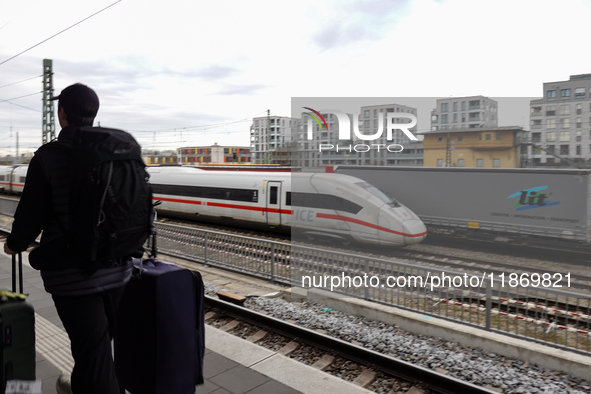 A Deutsche Bahn Intercity-Express (ICE) train passes through Munich Laim station in Bavaria, Germany, on December 14, 2024. The high-speed t...