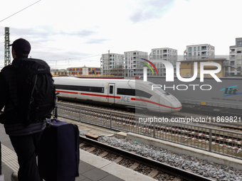 A Deutsche Bahn Intercity-Express (ICE) train passes through Munich Laim station in Bavaria, Germany, on December 14, 2024. The high-speed t...