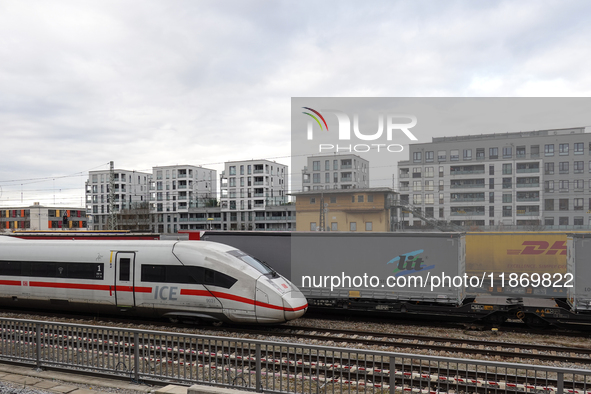 A Deutsche Bahn Intercity-Express (ICE) train passes through Munich Laim station in Bavaria, Germany, on December 14, 2024. The high-speed t...