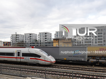 A Deutsche Bahn Intercity-Express (ICE) train passes through Munich Laim station in Bavaria, Germany, on December 14, 2024. The high-speed t...