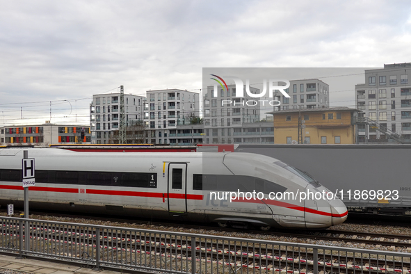 A Deutsche Bahn Intercity-Express (ICE) train passes through Munich Laim station in Bavaria, Germany, on December 14, 2024. The high-speed t...