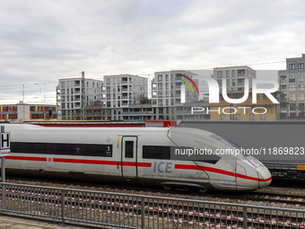 A Deutsche Bahn Intercity-Express (ICE) train passes through Munich Laim station in Bavaria, Germany, on December 14, 2024. The high-speed t...