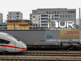 A Deutsche Bahn Intercity-Express (ICE) train passes through Munich Laim station in Bavaria, Germany, on December 14, 2024. The high-speed t...