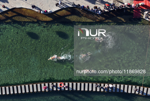 Winter swimming enthusiasts swim in the natural waters of Heilong Cave in Handan, China, on December 15, 2024. 