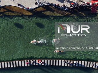 Winter swimming enthusiasts swim in the natural waters of Heilong Cave in Handan, China, on December 15, 2024. (