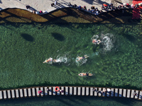 Winter swimming enthusiasts swim in the natural waters of Heilong Cave in Handan, China, on December 15, 2024. (