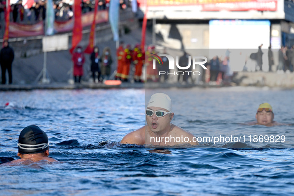 Winter swimming enthusiasts swim in the natural waters of Heilong Cave in Handan, China, on December 15, 2024. 