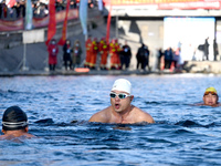 Winter swimming enthusiasts swim in the natural waters of Heilong Cave in Handan, China, on December 15, 2024. (