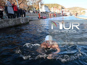 Winter swimming enthusiasts swim in the natural waters of Heilong Cave in Handan, China, on December 15, 2024. (