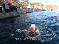 Winter swimming enthusiasts swim in the natural waters of Heilong Cave in Handan, China, on December 15, 2024. (