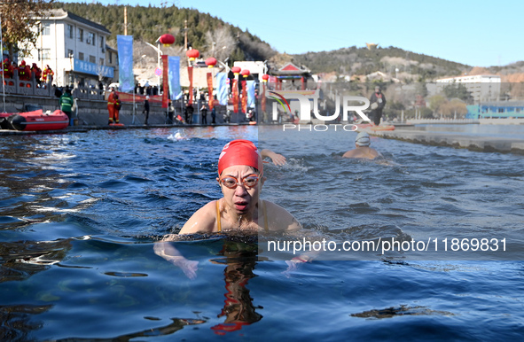 Winter swimming enthusiasts swim in the natural waters of Heilong Cave in Handan, China, on December 15, 2024. 