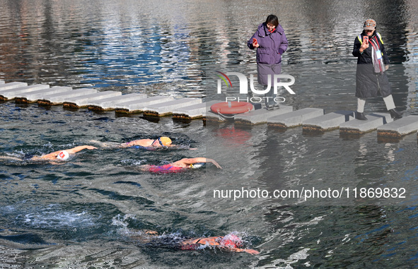 Winter swimming enthusiasts swim in the natural waters of Heilong Cave in Handan, China, on December 15, 2024. 