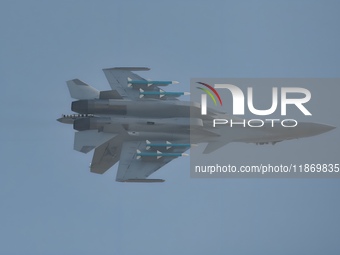 The Navy's J-15T carrier-based aircraft conducts a flight demonstration at the 2024 China Air Show in Zhuhai, Guangdong Province, China, on...