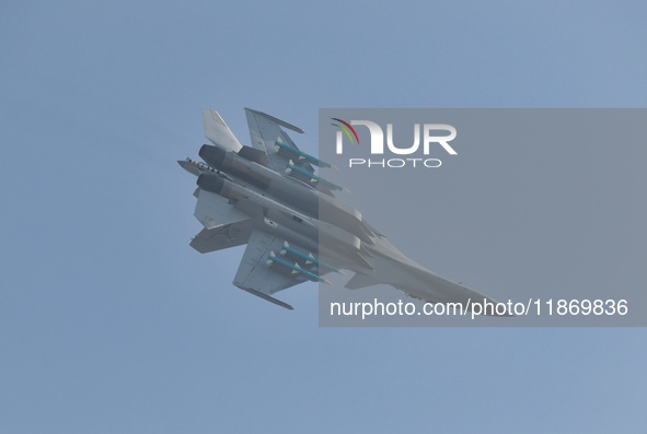 The Navy's J-15T carrier-based aircraft conducts a flight demonstration at the 2024 China Air Show in Zhuhai, Guangdong Province, China, on...