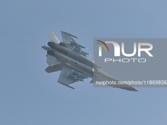 The Navy's J-15T carrier-based aircraft conducts a flight demonstration at the 2024 China Air Show in Zhuhai, Guangdong Province, China, on...