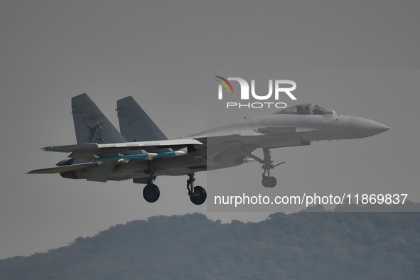 The Navy's J-15T carrier-based aircraft conducts a flight demonstration at the 2024 China Air Show in Zhuhai, Guangdong Province, China, on...