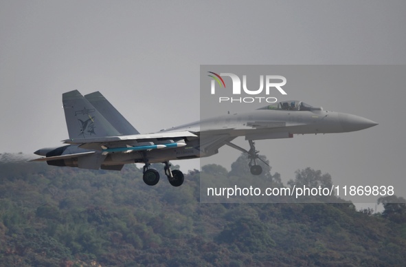 The Navy's J-15T carrier-based aircraft conducts a flight demonstration at the 2024 China Air Show in Zhuhai, Guangdong Province, China, on...