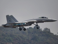 The Navy's J-15T carrier-based aircraft conducts a flight demonstration at the 2024 China Air Show in Zhuhai, Guangdong Province, China, on...