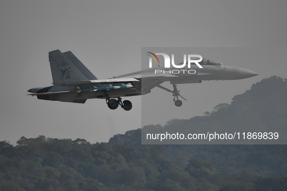 The Navy's J-15T carrier-based aircraft conducts a flight demonstration at the 2024 China Air Show in Zhuhai, Guangdong Province, China, on...