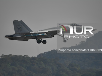 The Navy's J-15T carrier-based aircraft conducts a flight demonstration at the 2024 China Air Show in Zhuhai, Guangdong Province, China, on...